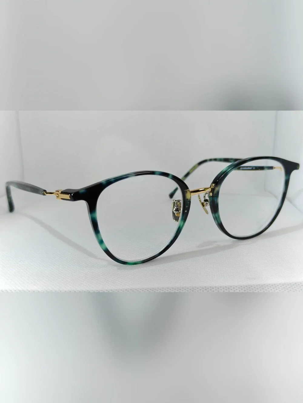 Aloft. Classic Round Women's Eyeglasses in Green Marble Tortoise Gold.